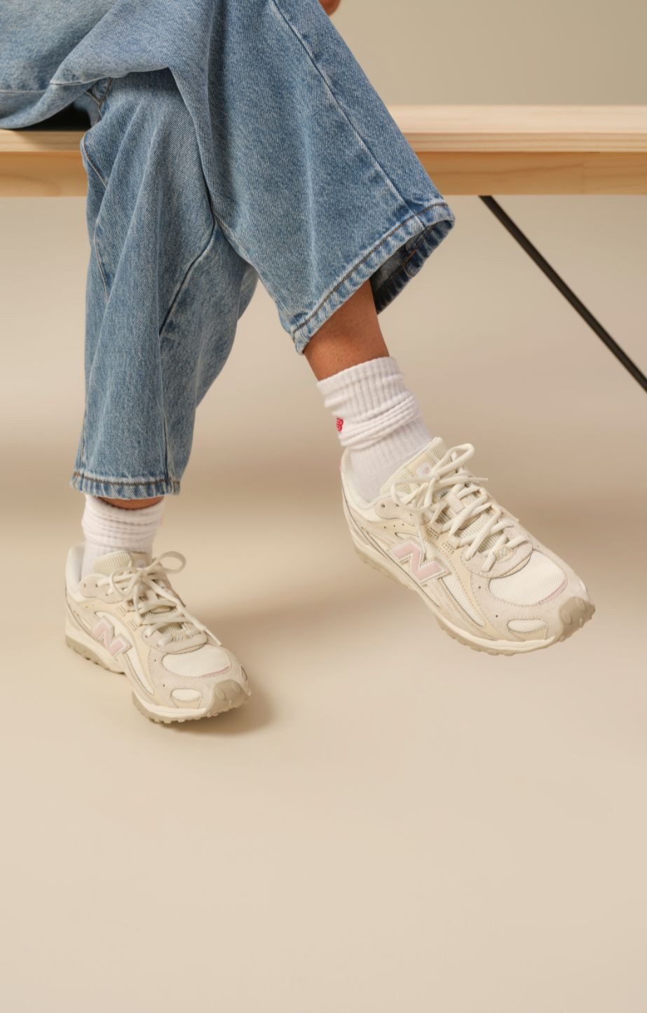 A person wearing New Balance 204L sneakers 